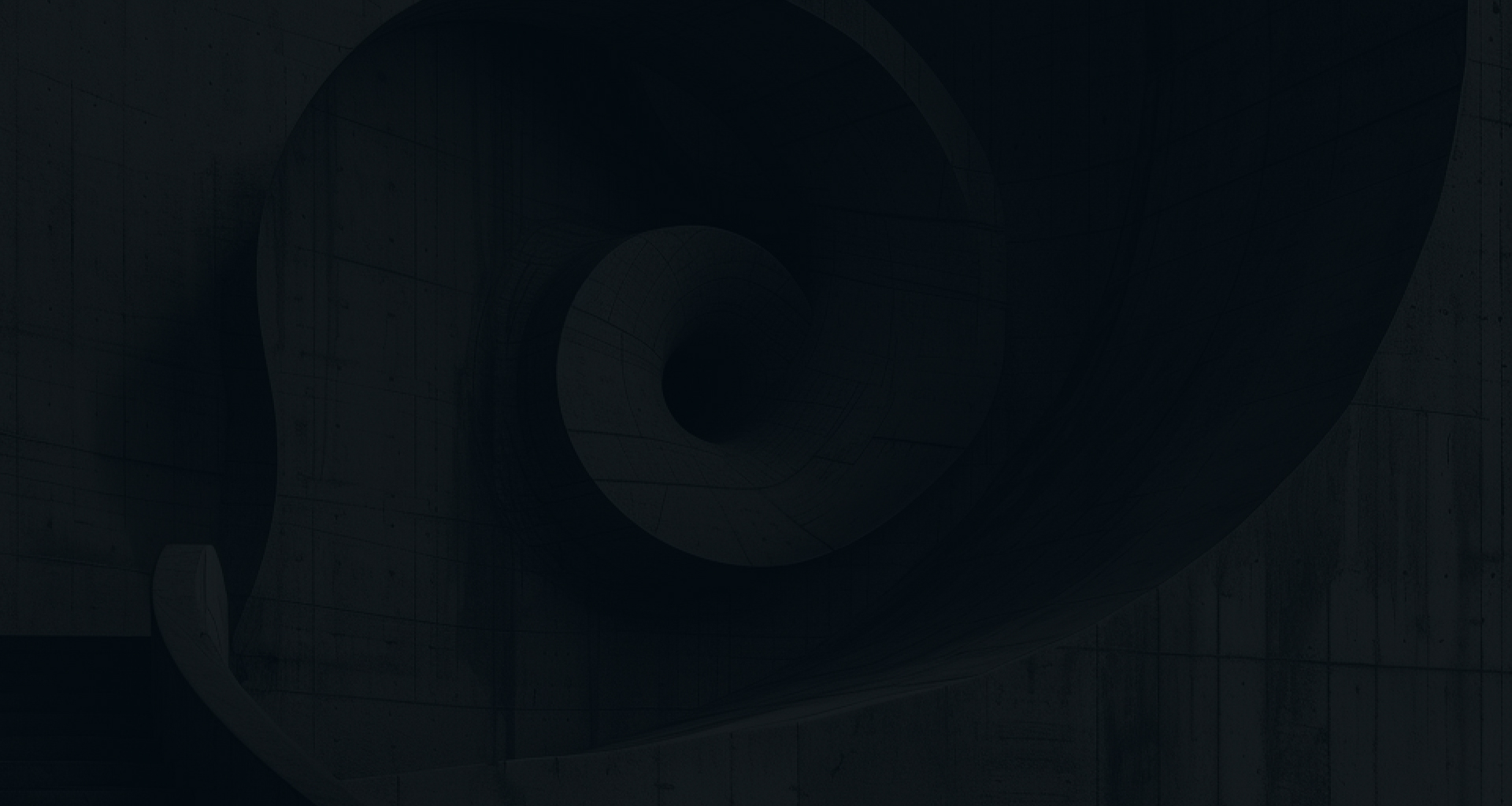 A dark, abstract architectural detail of a spiraling form, reminiscent of a nautilus shell or a spiral staircase, viewed from below.