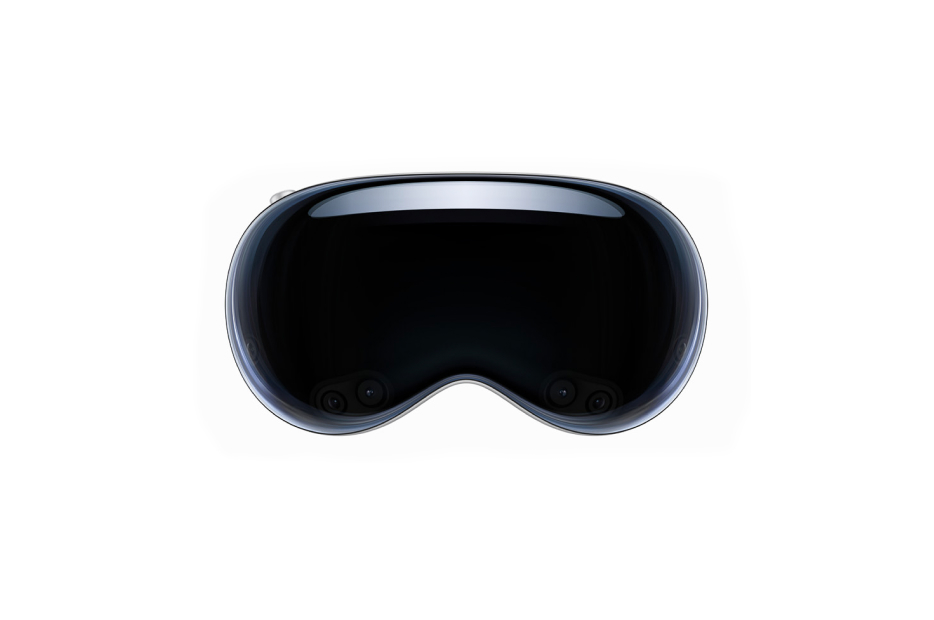 A close-up view of the front of a glossy black Apple Vision Pro VR headset, showing the curved design of the visor which likely shields the user's eyes for a fully immersive visual experience.